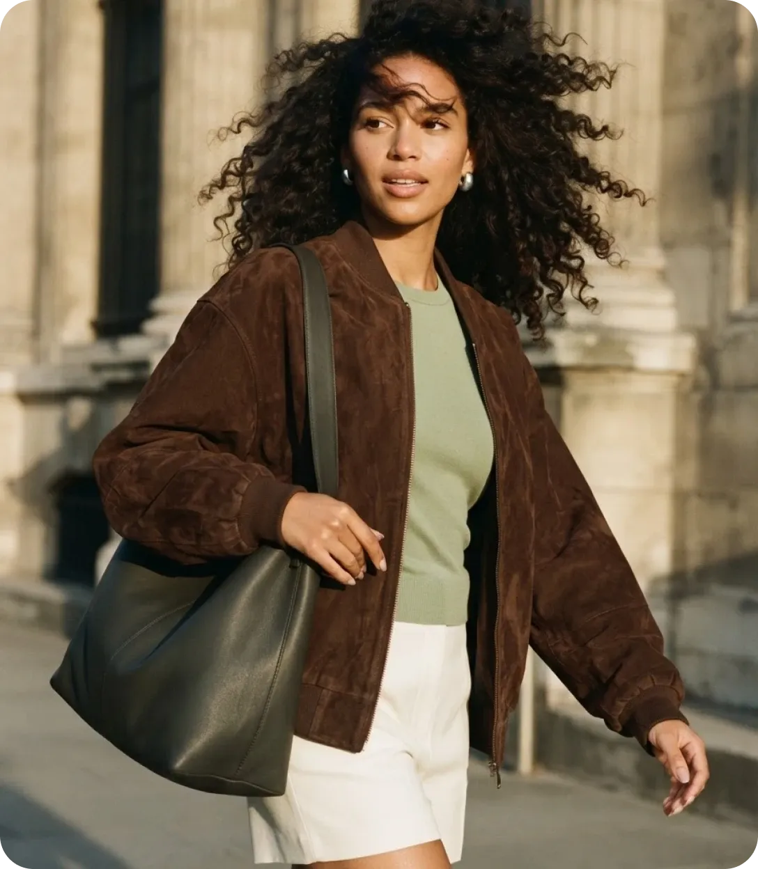 Woman walking with a green bag