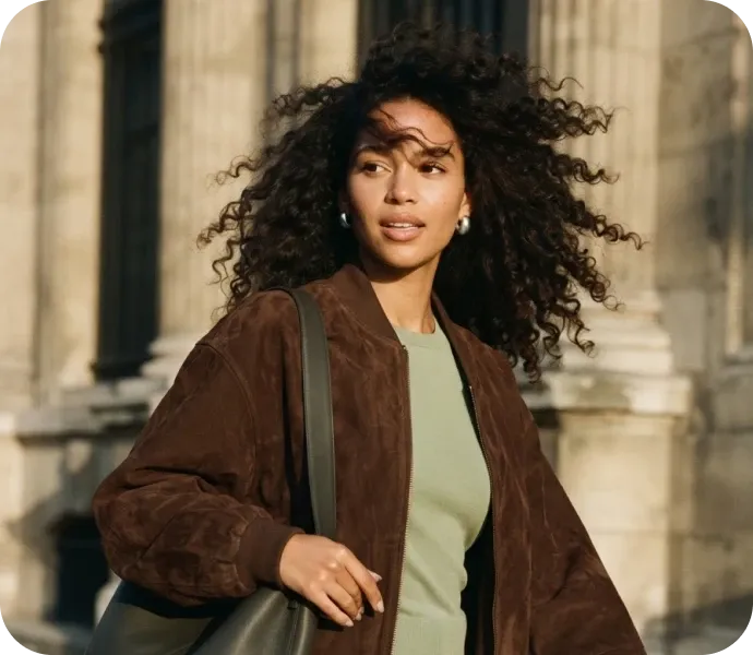 Woman walking with a green bag