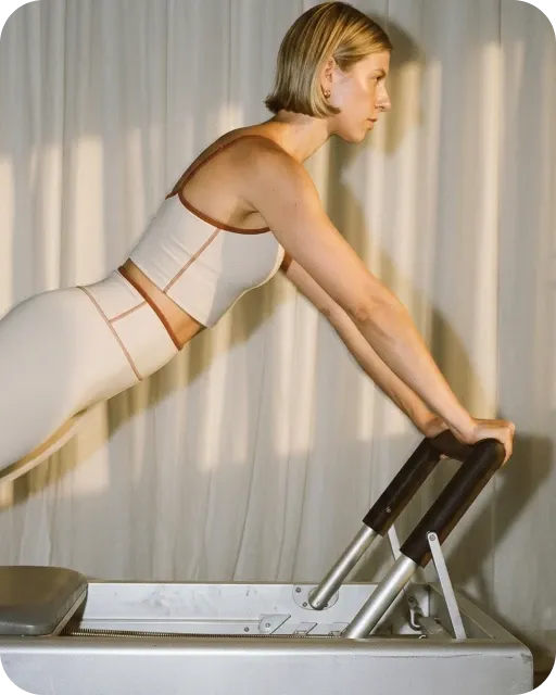 Woman training in a Pilates studio