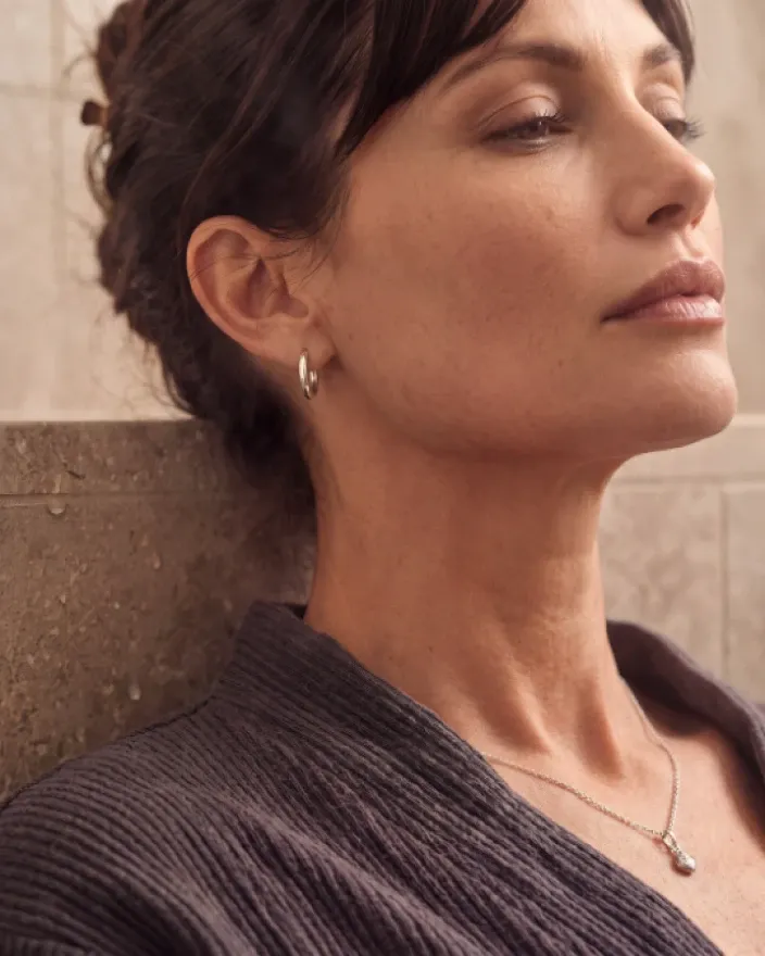 Close portrait of a woman in a purple top
